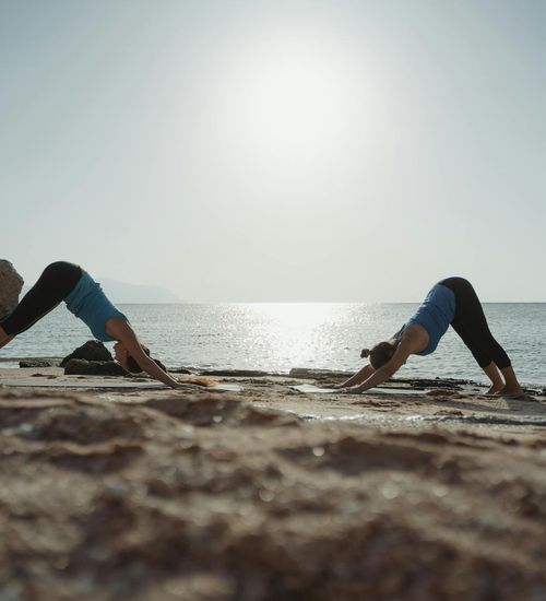 Person doing a stretching pose, emphasizing flexibility.